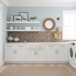 Bright kitchen with peel and stick wall tile backsplash and white cabinetry.