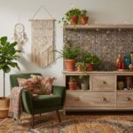 Cozy living room with peel and stick tile backsplash, green armchair, and boho decor.