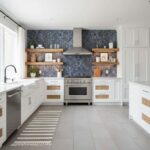 Modern kitchen with peel and stick wall tile backsplash behind stove and open shelving. Bright, clean, and stylish kitchen de.