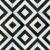Black and white geometric patterned tile with a matte finish, featuring sharp lines and a modern, bold design.