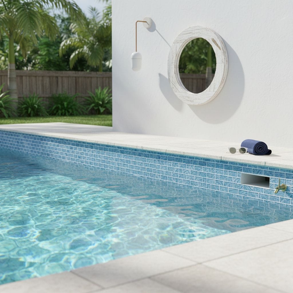 Poolside glass mosaic tile backsplash for a modern outdoor pool area.
