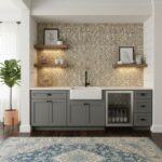 A stylish kitchen featuring a peel and stick tile backsplash behind the sink, with floating shelves and framed artwork, creat.