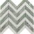 Green marble herringbone tile with textured surface and polished finish.