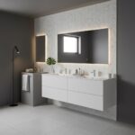 Bright white bathroom vanity with sleek design, large mirror with backlighting, and minimalist decor.