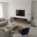 Modern living room with white textured wall tiles, sleek wooden TV console, and contemporary decor.