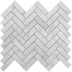 White marble herringbone tile with smooth texture and subtle gray veining, ideal for elegant wall or floor accents.