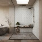 White herringbone patterned tiles with textured surface in the shower area.