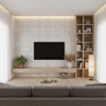 Beige wood-textured tile wall with built-in shelving and a flat-screen TV.