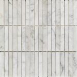 Marble tile featuring a white and gray color palette with a smooth, polished texture and subtle veining. Thin grout lines cre.