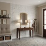 Beige and white ceramic tile wall with a subtle geometric pattern, complemented by a wooden console table and decorative acce.