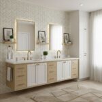 A modern bathroom with peel and stick wall tiles behind a double vanity with gold fixtures and framed mirrors.