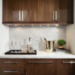 Mother of pearl shell tile used as a stylish kitchen backsplash with a modern design.