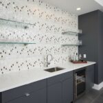 Elegant shell tile backsplash with mother of pearl accents in a modern kitchen setting.