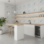 Modern kitchen with mother of pearl shell tile backsplash, featuring blue accents and minimalist design.