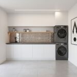 Laundry room tile with brick backsplash and modern appliances.