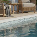 Blue mosaic tile with smooth, glossy texture and intricate pattern.
