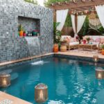 Colorful mosaic tiles in shades of blue and gray with textured surface.