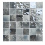 Gray and silver mosaic tile with textured and glossy finishes, featuring a mix of smooth and patterned surfaces.