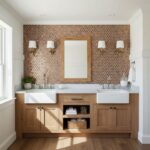 Copper hexagon tile backsplash with a matte finish, complementing the wooden vanity and white sinks.