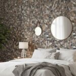Colorful mosaic tile wall with textured surface behind bed, featuring round mirrors and neutral decor.