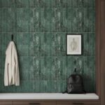 Green marble tile wall with glossy finish and textured surface.
