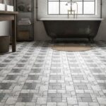 Gray textured stone tiles with a matte finish in a bathroom setting.