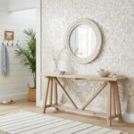 Neutral beige mosaic tile wall with textured surface and subtle color variations, creating a natural and elegant look.