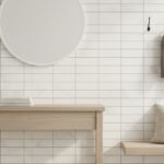 White ceramic wall tile with subtle textured surface and clean lines, complemented by minimalist decor and accessories.