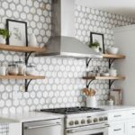 White hexagon ceramic tiles with subtle texture and glossy finish, creating a clean and contemporary look.