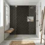 Black and gold geometric patterned tile with a matte finish in the shower area.