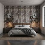 Geometric patterned tiles in shades of gray, beige, and brown create a modern accent wall behind the bed.