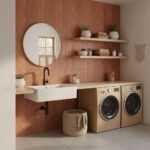 Bright laundry room with warm brick tile wall, white sink, and modern appliances.