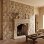 Earth-toned stone tiles with a textured, rustic finish covering the fireplace wall.