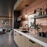 Beige textured tile backsplash with geometric pattern, in a contemporary kitchen setting.