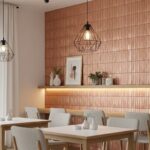 Light beige ceramic tile wall with textured surface and subtle pattern behind dining table.