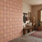 Pink terracotta tiles with matte finish, textured surface, warm earthy tone.