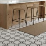 Light gray and white textured ceramic tile with a matte finish.