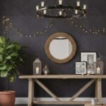 Black slate tile wall with textured surface and matte finish, complemented by rustic decor and warm lighting in a cozy interi.