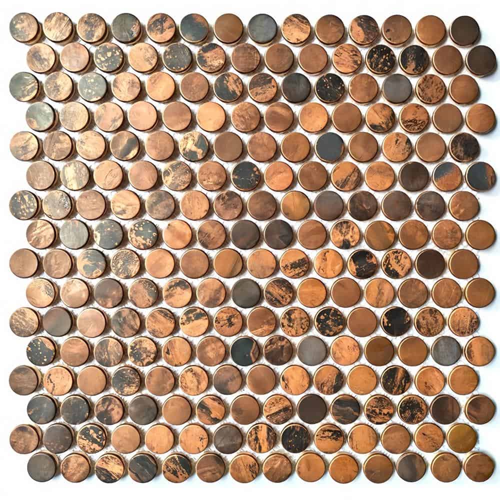 A mosaic tile composed of small, round stones in shades of brown, beige, and gray with a textured, natural surface.