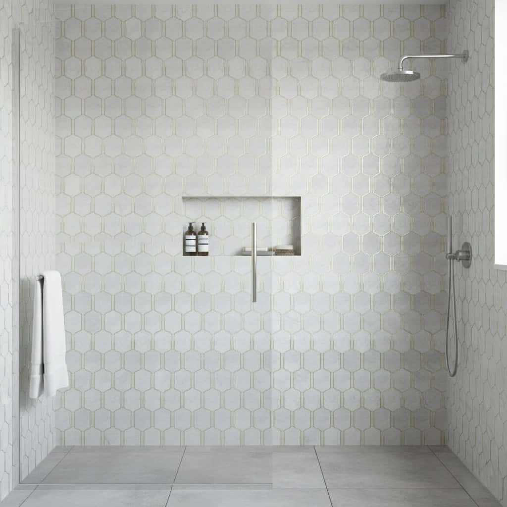 White hexagon tiles with subtle texture in a modern shower.