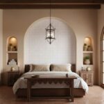 Bright bedroom featuring a white tiled wall behind the bed, wooden furniture, and warm lighting creating a cozy atmosphere.