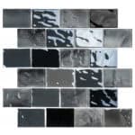 Glossy black and gray mosaic tiles with abstract patterns, smooth texture, contemporary style.