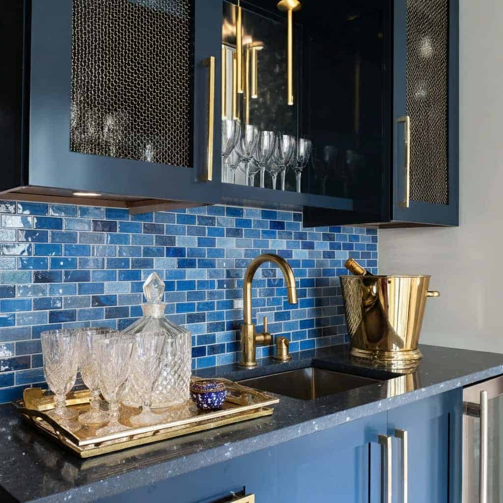 Blue glass tile backsplash with glossy finish and textured surface.