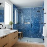 Blue mosaic tiles with textured surface in the shower area.