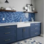 Blue mosaic tile backsplash with glossy finish and textured surface.