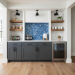 Blue mosaic tile with textured surface in kitchen backsplash.