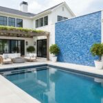 Blue mosaic tile with textured surface, used on pool wall for a vibrant, stylish look.