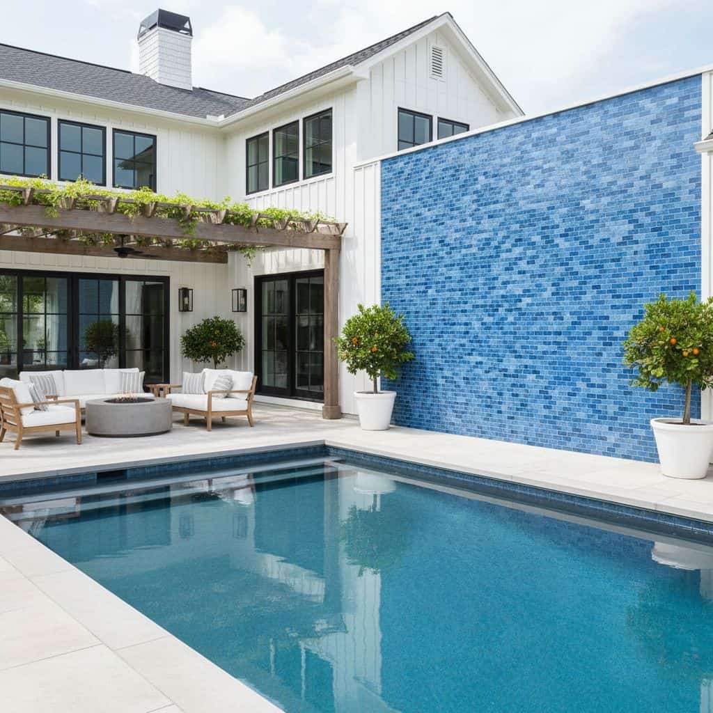 Blue mosaic tile with textured surface, used on pool wall for a vibrant, stylish look.