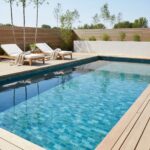 Blue mosaic pool tile with textured surface, vibrant color, and contemporary style. Perfect for outdoor swimming pools, addin.