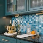 Blue mosaic tile with glossy finish and textured surface.
